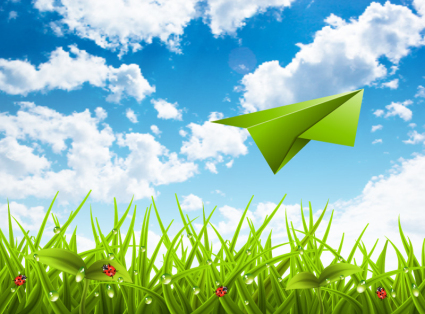Paper airplane flying over grass vector material
